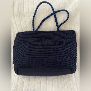 Deep blue color. Evening beg. 
 Width 9 inches. Depths  6 inches. Cord handle.